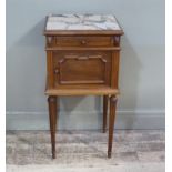 A French beech bedside cupboard the top inset with a marble panel above short panelled drawer and