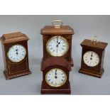 Four quartz mantel clocks in wooden and faux wooden cases, various makers, 21cm high and smaller