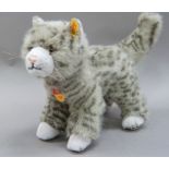 A Steiff cat Mizzy with buttoned ear and paper label