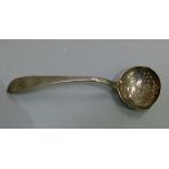 A George III Irish sifter spoon bright cut with vacant navette shaped cartouche the bowl pierced, by