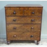 A Victorian mahogany chest, the rectangular top above figured frieze and two short and three long