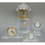Four pressed glass cased clocks with quartz movements, two in longcase clock case, another two