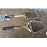A Slazenger wooden tennis racket and press; together with a Dunlop wooden tennis racket and press (