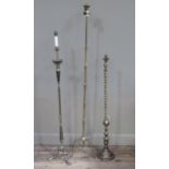 Three brass standard lamps, to include an open brass barley twist lamp, another of bamboo style on