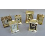 Six carriage clock style clocks in brass and gilt plastic cases, including examples by Lincoln,