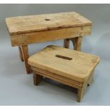 Two small pine stools, both rectangular with carrying handles to the tops