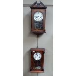 Thirty-one day wall clock in stained wooden case enamelled dial; together with another by Legend (2)