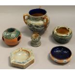 A collection of Royal Doulton stoneware including, a silver collared match holder, a flower