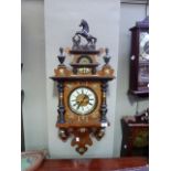 Ornate walnut wall clock applied gilt metal mounts, the pediment with horse finial, the glazed