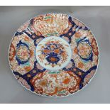 A Japanese Imari porcelain circular charger decorated in typical palette, 46cm diameter