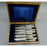 A set of six Victorian silver plated dessert knives and forks, foliate engraved blades and tines the
