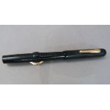 A vintage Conklin crescent filler fountain pen in a black case with wavy decoration 14k nib the