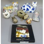 A Muggins June 2003 cat money bank; together with a Portuguese cat ornament with pierced lid,