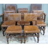 A set of eight oak dining chairs in late 17th century style, the rectangular backs and stuffed