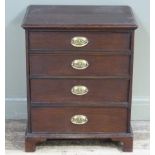 A mahogany stained chest of four long graduated drawers with bracket feet, oval brass escutcheons,