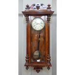 A 19th century walnut veneered wall clock with broken pediment centred on horse finial, the arched