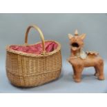 A deep wicker basket red and white cotton lining, together with a terracotta dog planter, 37cm