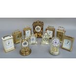 A quantity of mantel clocks mainly carriage style, brass and silvered plastic cases, two beneath