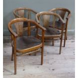 A set of four bentwood chairs with pressed seats on moulded tapered legs