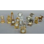 A quantity of miniature timepieces brass, white metal and glass including novelty examples