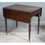 A 19th century mahogany pembroke table on turned legs with drawers to the apron and opposing dummy