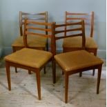 A set of four teak dining chairs with railed backs; together with a Formica topped drop leaf kitchen