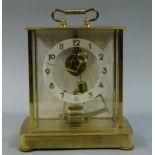 A Keininger & Obergfell Kundo gilt metal and glass cased clock c.1960s skeleton movement, silvered