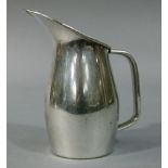 Gerald Benney for Viners, a polished pewter cream jug with broad lip, 12cm high