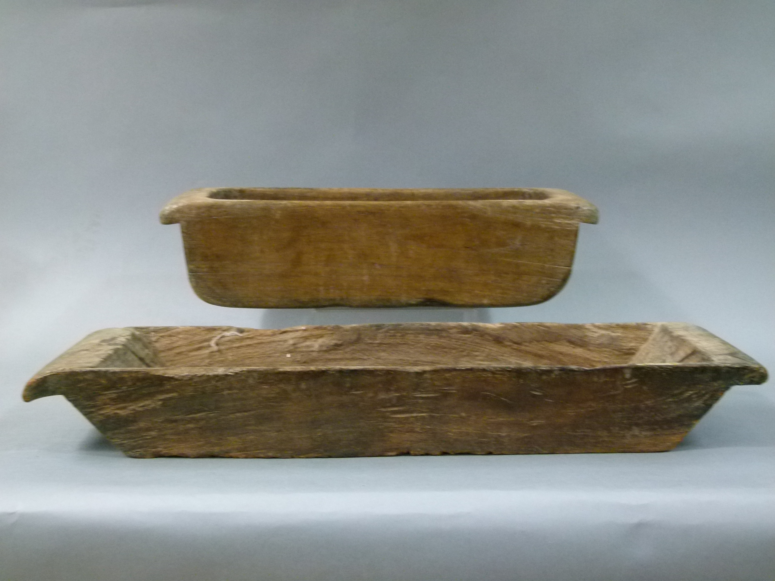 Two wooden troughs, 54cm long x 16cm wide x 14.5cm high, 73cm long x 22cm wide x 10cm high