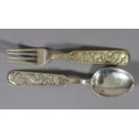 David Andersen, Norway, a child's .830 sterling silver spoon and fork set, each handle decorated