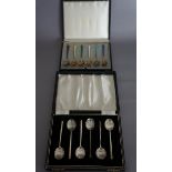 Egon Lauridsen, a set of six silver gilt and enamel teaspoons, the tapered stems variously coloured,