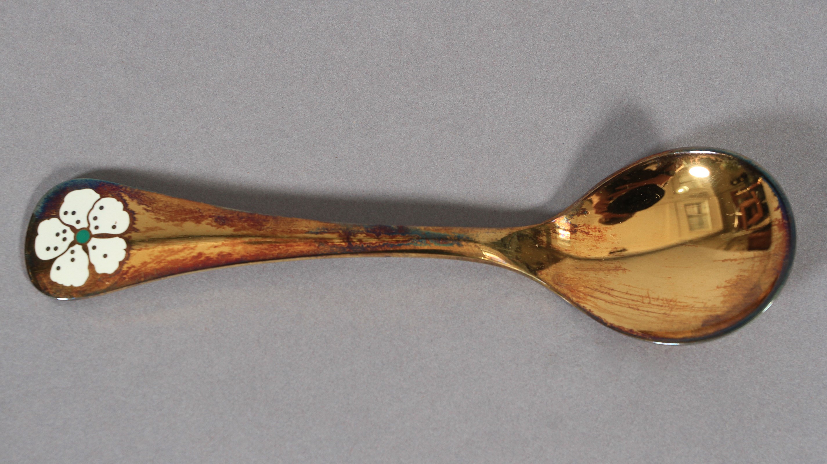 Georg Jensen, a .925 silver gilt year spoon for 1971 with cherry blossom motif in white and green