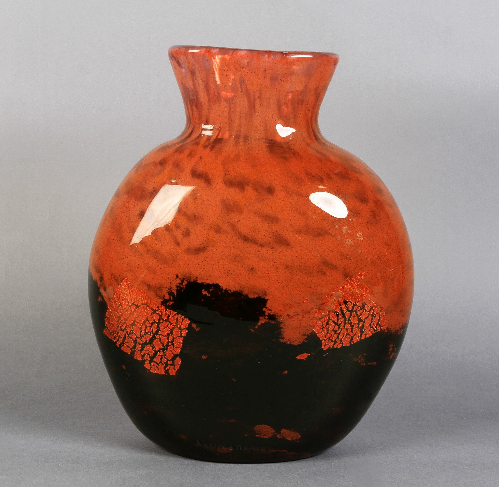 An art glass vase of black and orange cased glass, the ovoid flask shape body bearing etched 'Dawn