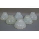 A set of six opaline glass, holophane light shades, 15.5cm diameter max