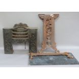 A cast iron table base and granite top together with a cast iron bedroom grate