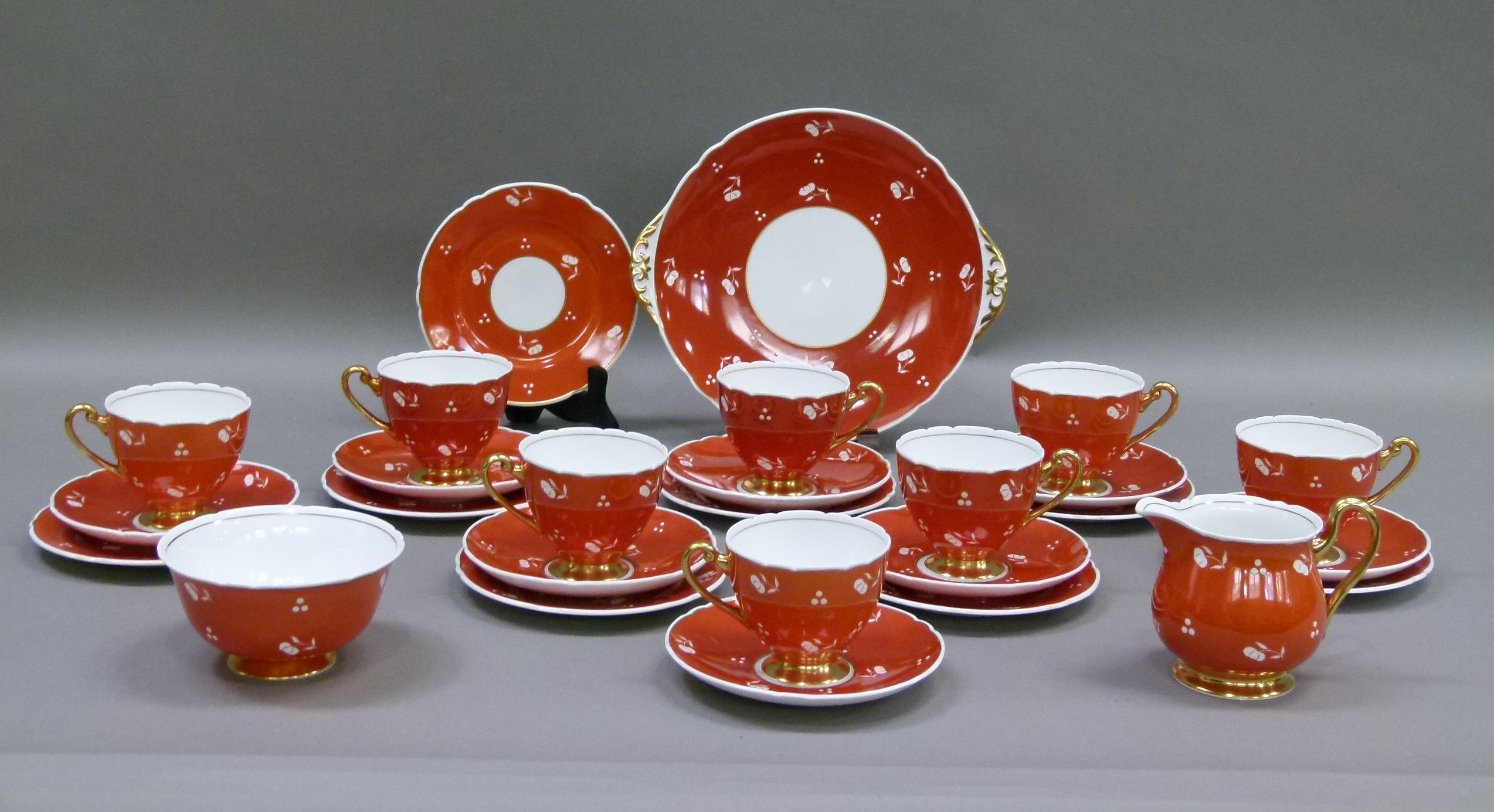 A Shelley bone china tea service comprising bread and butter plate, sugar, cream, eight cups,