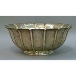 A Victorian silver petal shaped circular bowl with fluted vertical panelled body, 25cm diameter by