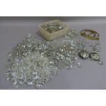 A large quantity of cut glass chandelier parts including drops, crystals, drips and lustres