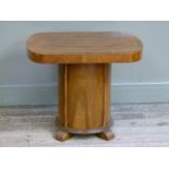 An Art Deco style two tier table or buffet, the butterfly-veneered rising rounded rectangular top
