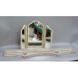 A cream and floral decorated triptych dressing table mirror, 64cm high together with a painted