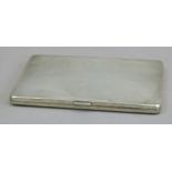 A George V engine turned silver cigarette case, 12.5cm wide by Adie Bros Birmingham 1933,