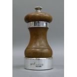 A silver mounted wooden pepper mill, conventional form, by PG Company, London 1963