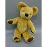 A Merrythought Ironbridge Shropshire plush teddy bear, bearing label, 40cm high approximately