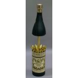 A vintage Hennessey cognac musical bottle shaped cigarette dispenser, 31cm high