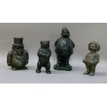 A Transvaal money box cast as a bellied squat bearded gentleman, 15cm high; a reproduction cast iron