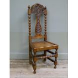 A Victorian oak hall chair with shaped cresting and flat baluster splat, carved with mask and