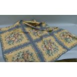 An Aubusson styled rug machine woven with panels of fruit in shades of blue, biscuit and iron red,