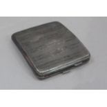 A George V engine turned silver cigarette case, 10cm wide by F F , Birmingham 1926, 4oz