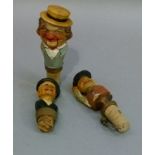 Three carved softwood novelty bottle stoppers, all as head and shoulder busts of gentlemen wearing
