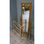 A reproduction pine cheval mirror the rectangular bevelled plate within cushion moulded frame